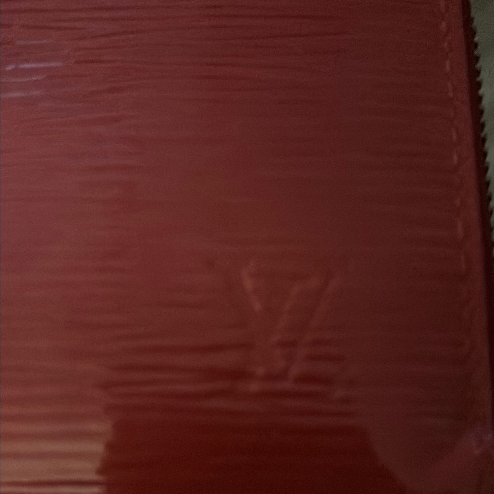 Louis Vuitton Red Epi long zip wallet.
